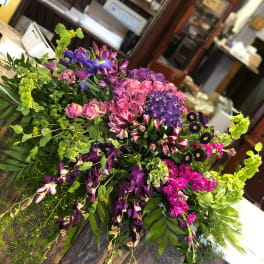Large mixed bouquet with purple, pink, and green flowers