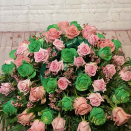 Large bouquet of pink and green roses with ribbon