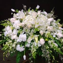 White floral spray with lilies, roses, and hydrangeas