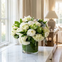 White floral arrangement in a clear glass vase