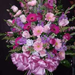 Large pink and purple mixed bouquet with a satin ribbon bow