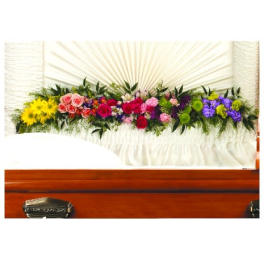 Colorful floral casket spray with roses and daisies