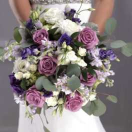 Bridal bouquet of pink, white, and purple flowers