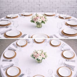 Round table centerpiece with pink and white flowers in a glass vase