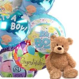 Teddy bear with assorted blue and multicolor "It’s a Boy" and "Congratulations" balloons