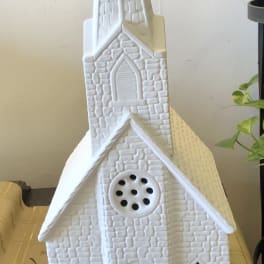 White decorative church figurine with a tall steeple
