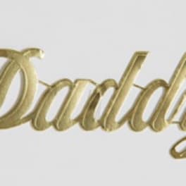 Gold script word "Daddy" on a white background