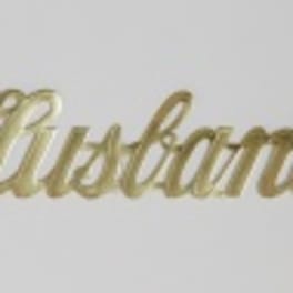 Gold script reading "Husband" on a white background