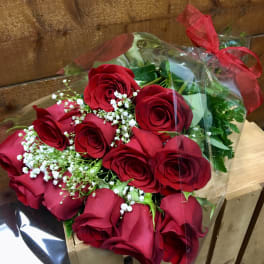 Bouquet of red roses with baby's breath in clear wrap