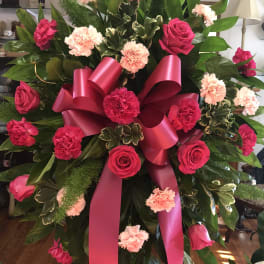 Pink and red funeral spray