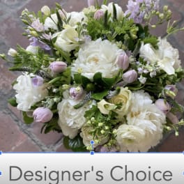 Bouquet of white and pale pink flowers with a designer's choice label