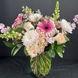 Pink and white mixed bouquet in a clear glass vase
