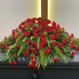 Red carnation casket spray