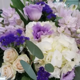 Lavender and white bouquet with roses, hydrangeas, and lilies