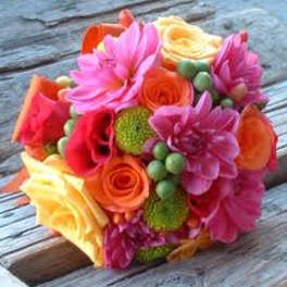 Bright mixed bouquet of pink, orange, and yellow flowers