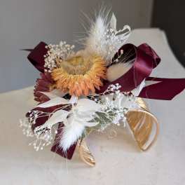 Gold corsage cuff.