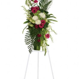 Tall floral spray with pink and white flowers on a standing easel
