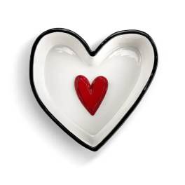 Heart-shaped white dish with a red heart in the center