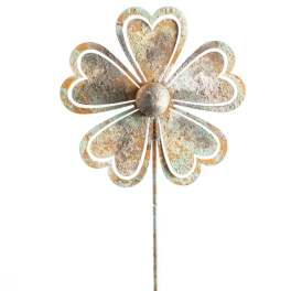 Metal flower-shaped garden stake with a weathered finish