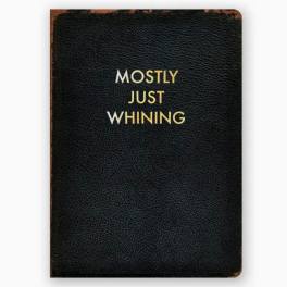 Black notebook with gold text reading Mostly Just Whining