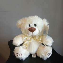 White plush teddy bear with a gold ribbon bow