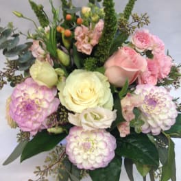 Bouquet of pink and cream roses with lavender dahlias and greenery