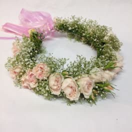 Pink rose flower crown with baby's breath and a pink ribbon