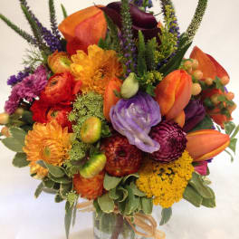 Colorful mixed bouquet in a clear glass vase