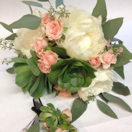 Bouquet of white peonies and pink spray roses with succulents