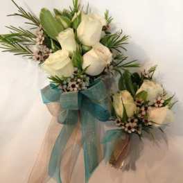 White rose bouquet with blue ribbon and matching boutonniere