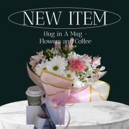 Bouquet of pink and white flowers with a coffee cup and gift items