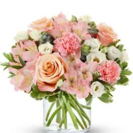 Pink and peach bouquet in a clear glass vase