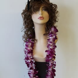 Mannequin wearing a graduation cap and purple orchid lei