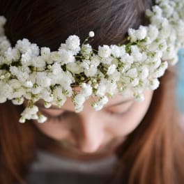 Woman wearing a white baby's breath flower crown