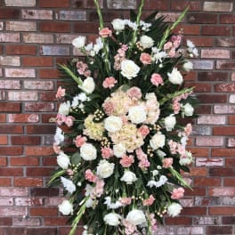 Standing floral spray with white roses and pink blooms