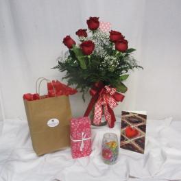 Bouquet of red roses with a heart ribbon, plus gift bag and chocolates