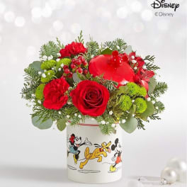 Red roses and carnations in a Disney-printed vase