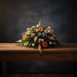 Casket Cover Of Peach, Pinks, Yellows & Purple - Huntsville sympathy delivery