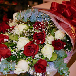 Bouquet of red and white roses with baby's breath and eucalyptus