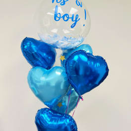 Blue heart balloons with a clear balloon reading "It's a boy!"