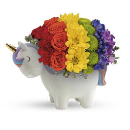 Rainbow flower arrangement in a unicorn-shaped ceramic container