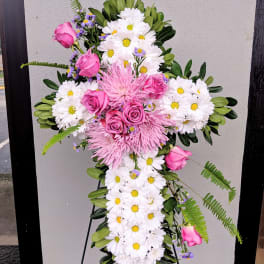 Cross-shaped floral spray with pink roses and white daisies