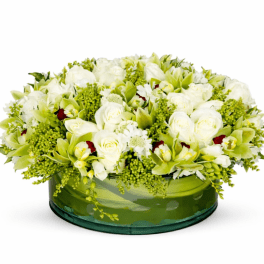White and green floral arrangement in a low glass bowl