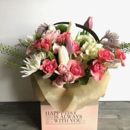 Pink and white mixed flower bouquet in a gift box