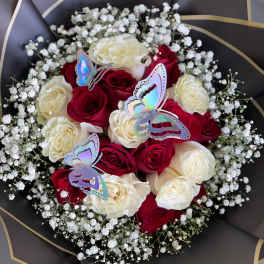 Bouquet of red and white roses with baby’s breath and butterfly picks