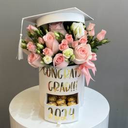 Pink rose bouquet in a white graduation box with chocolates