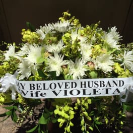 Casket arrangement of white chrysanthemum and green orchid