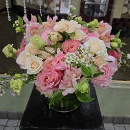 Pink and white mixed bouquet in a glass vase