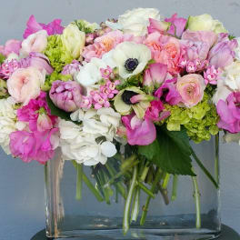 Pink and white mixed bouquet in a clear glass vase