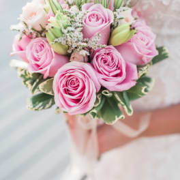 Pink rose bouquet with white filler flowers and green buds